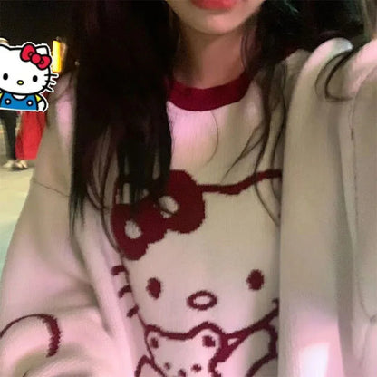 Top tipo suéter suelto de manga larga con cuello redondo de Hello Kitty