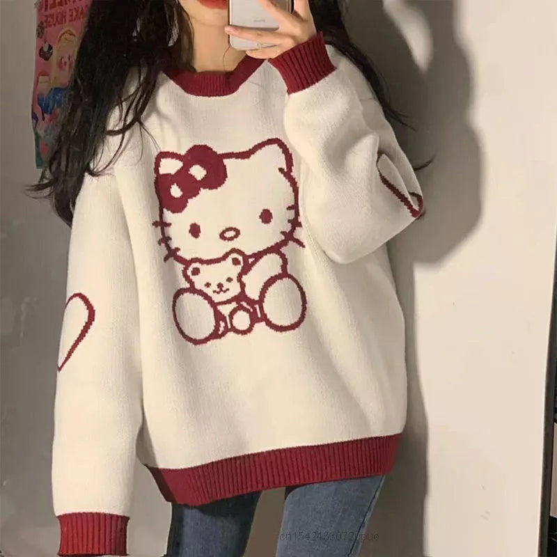 Top tipo suéter suelto de manga larga con cuello redondo de Hello Kitty