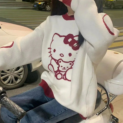 Top tipo suéter suelto de manga larga con cuello redondo de Hello Kitty