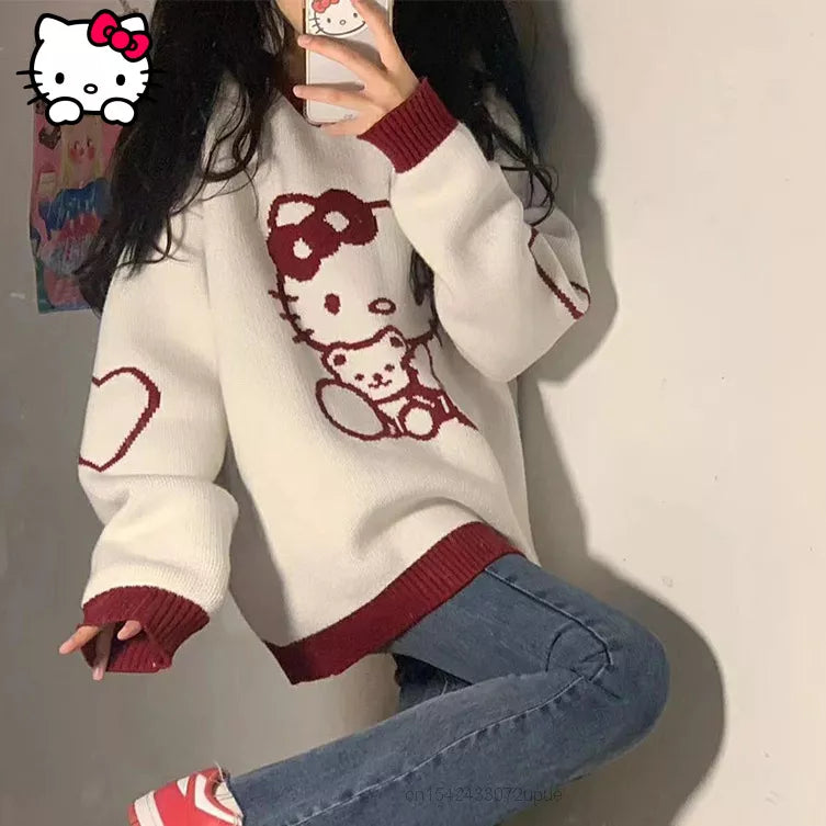 Top tipo suéter suelto de manga larga con cuello redondo de Hello Kitty